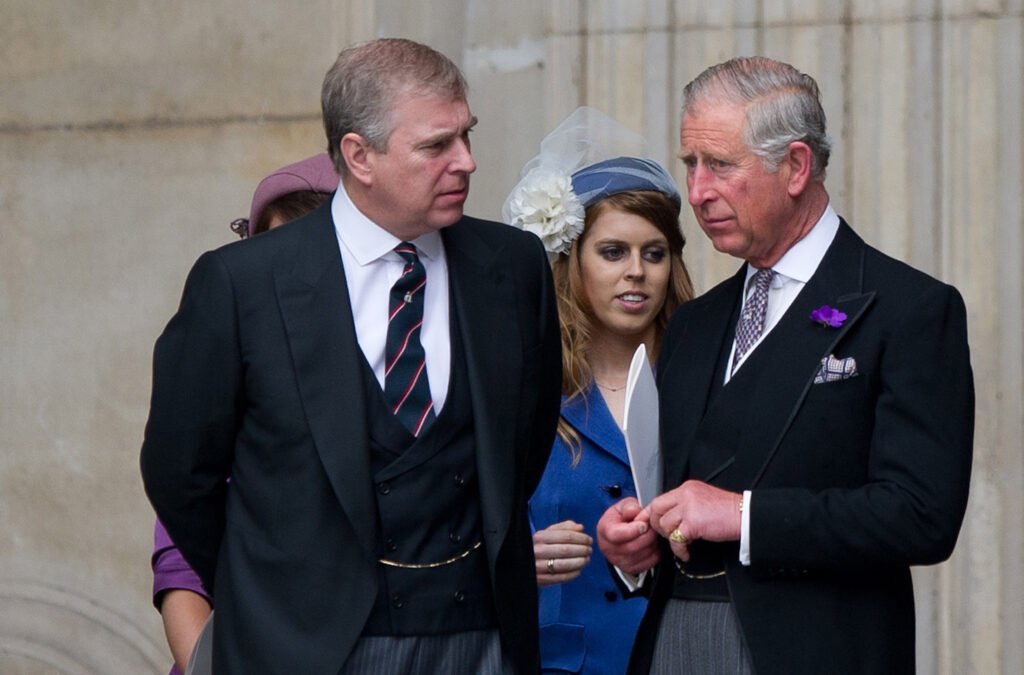 Prince Andrew on the left, speaking with Prince Charles on the right