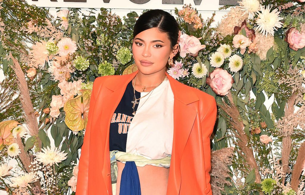 Kylie Jenner in an orange and white outfit