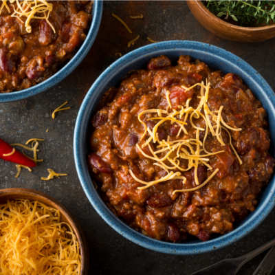 Bowls of chili and some cheese