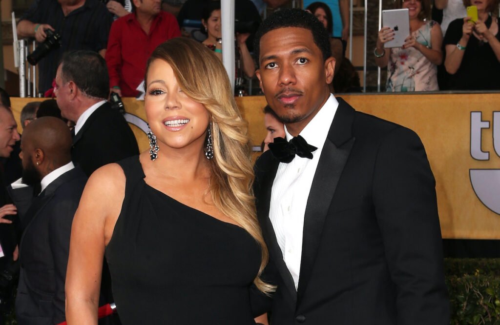 Mariah Carey in a black dress with Nick Cannon in a tux