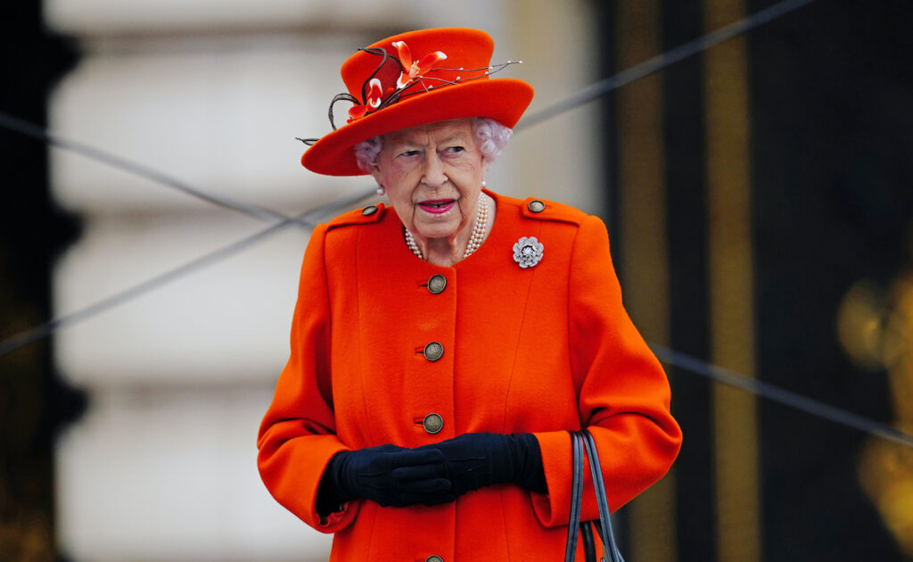 Queen Elizabeth in a red outfit