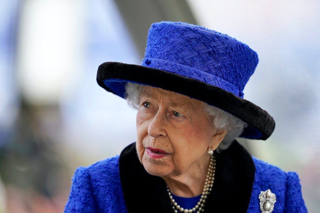 Queen Elizabeth in a blue outfit and hat