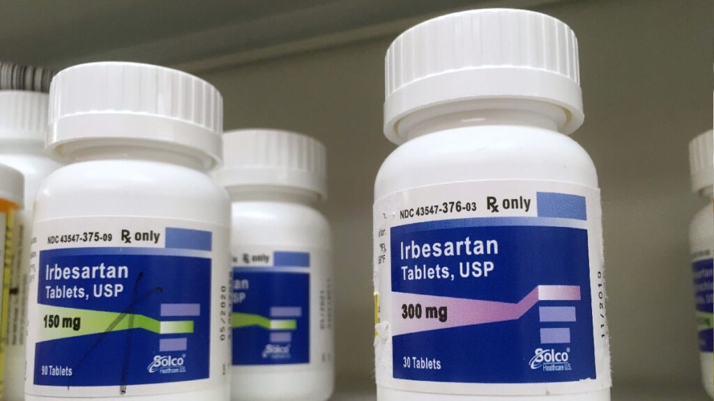 Bottles of Irbesartan tablets sitting on a shelf