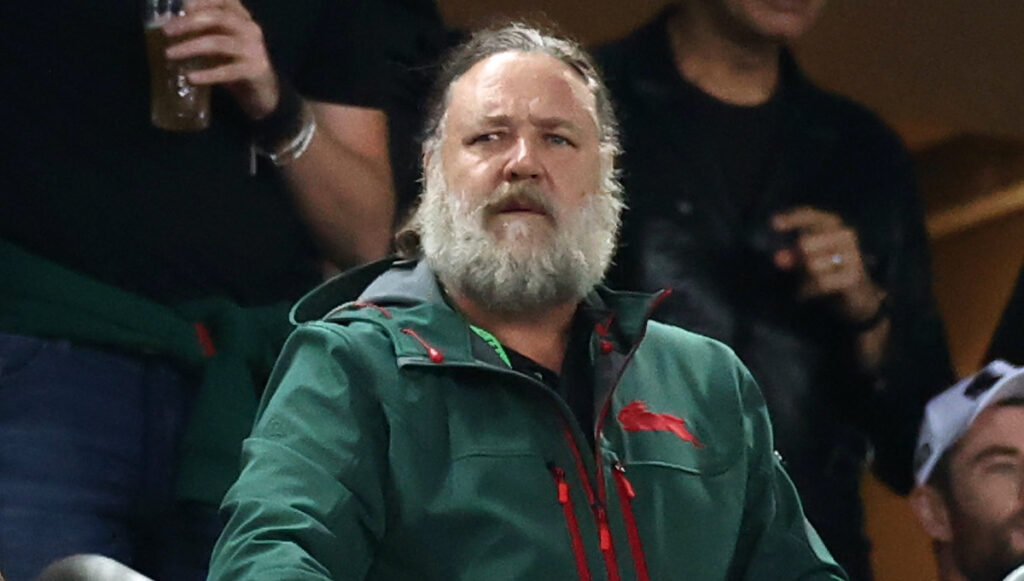 Russell Crowe in a green jacket