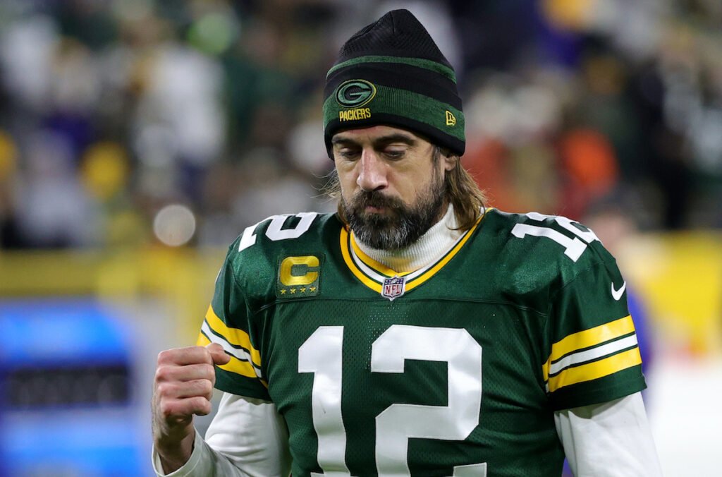 Aaron Rodgers in a Packers uniform and beanie