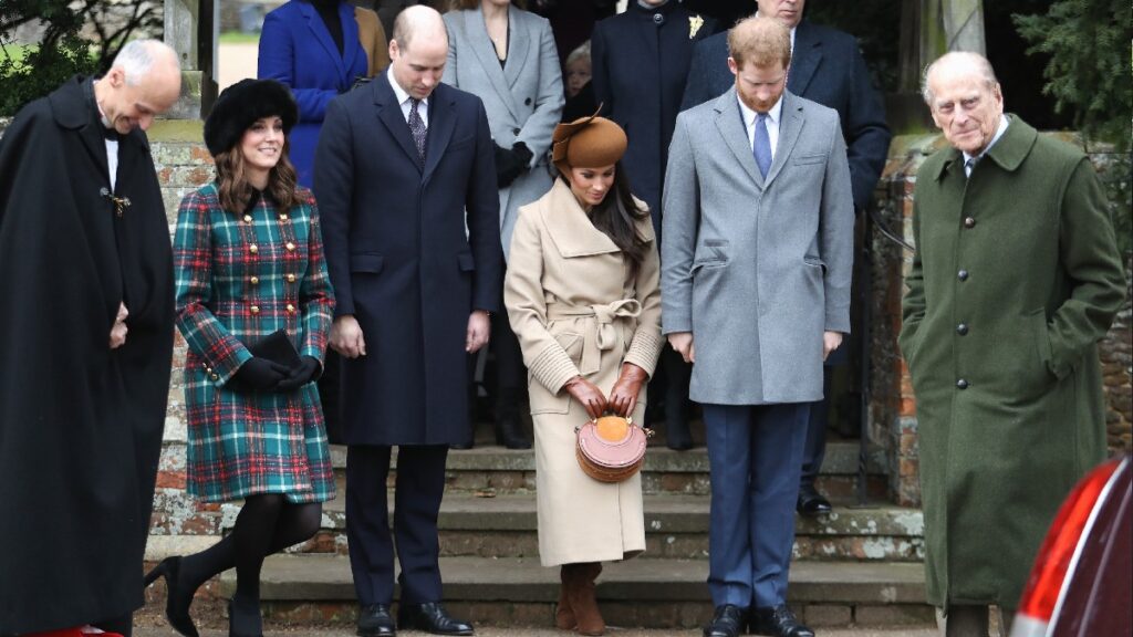 Kate Middleton, Prince William, Meghan Markle, Prince Harry, and Prince Philip stand together at a royal event