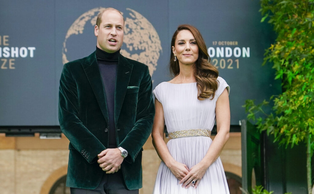 Prince William in a green tuxedo with Kate Middleton in a white dress