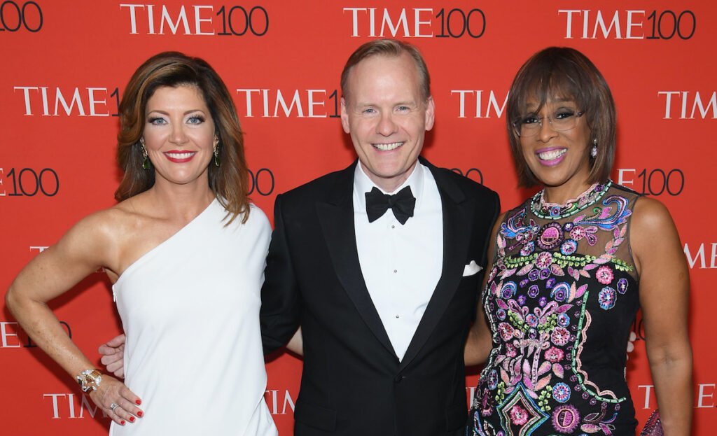 Norah O'Donnell in a white dress, John Dickerson in a tux, and Gayle King in a pink and blue dress