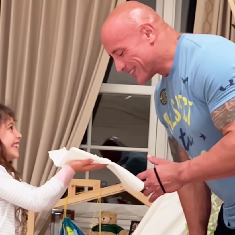 In Sweet Video, The Rock Hilariously Attempts to Protect himself As His Daughters Poke at Him