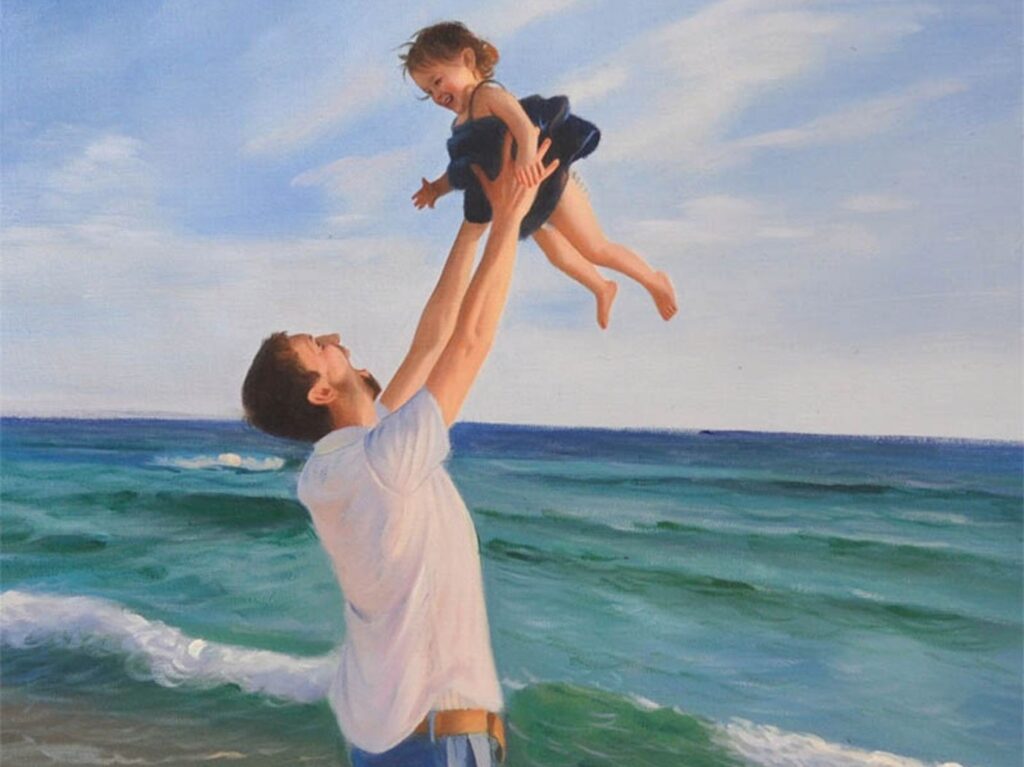 Portrait of daughter and father playing by the ocean