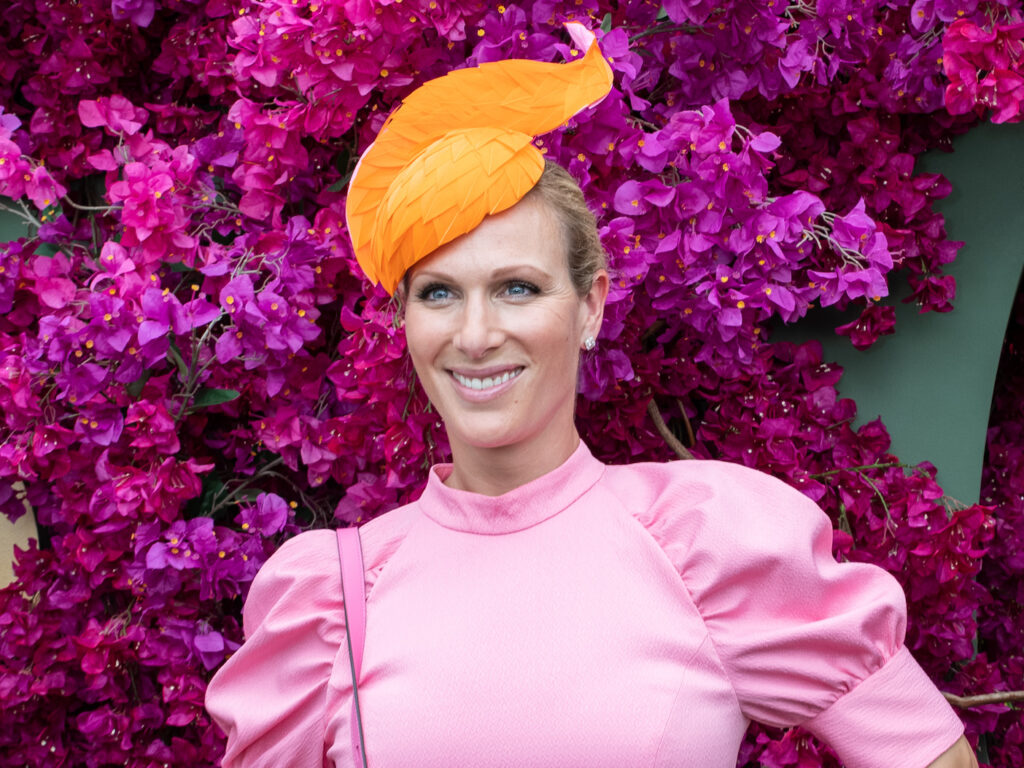 2020 photo of Zara Tindall in a pink dress and orange hat