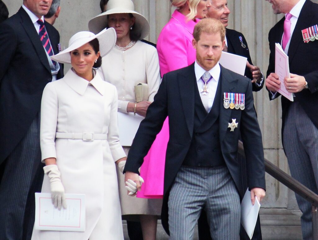 Prince Harry and Meghan Markle walking out of an English church service