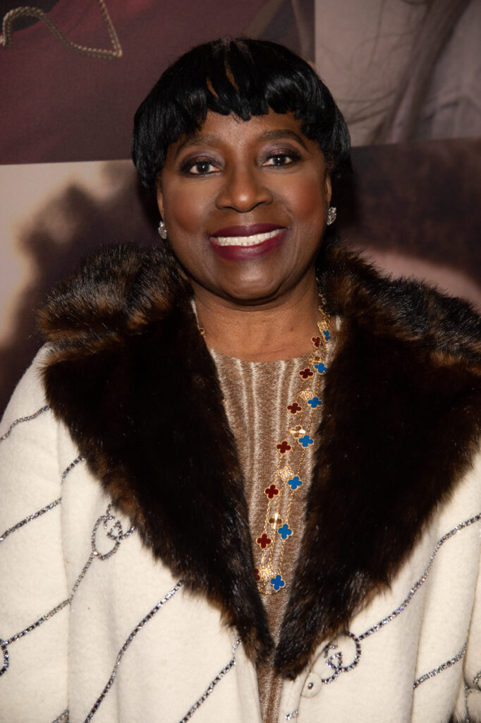 LaTanya Richardson Jackson smiling in white coat with brown fur trim