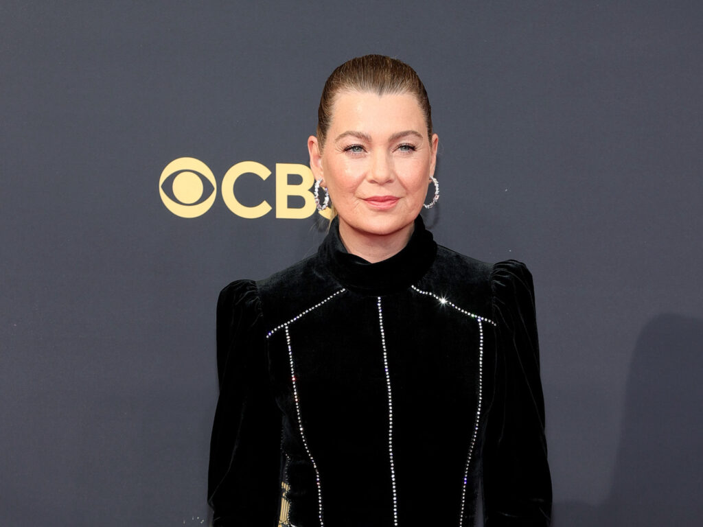 Ellen Pompeo in a black dress with her hair in a tight bun