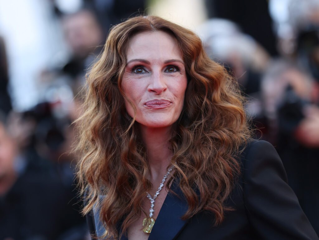 close up of Julia Roberts in a black jacket and silver necklace