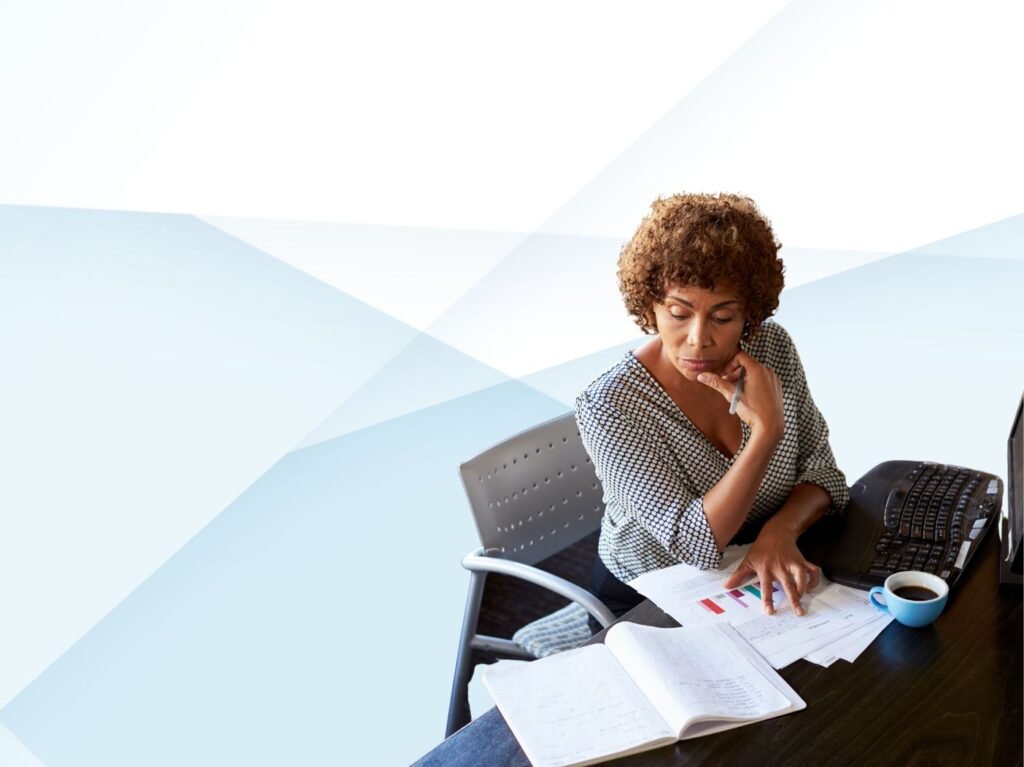 midlife Black woman working at desk