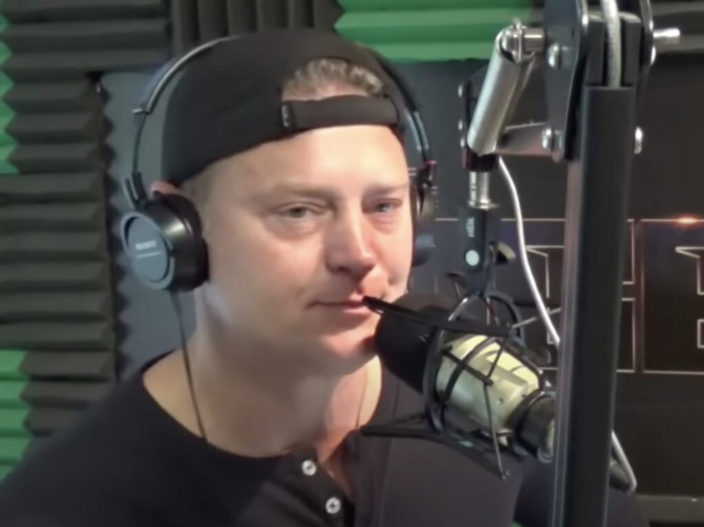 screenshot of Vic Faust hosting The Edge in a black shirt and hat