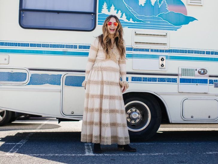 Kristen Phillipkoski in front of the vintage camper.