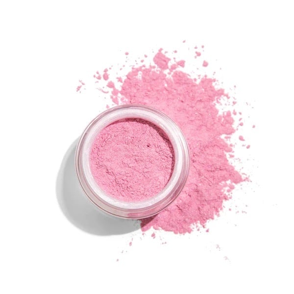 a pot of pink mineral powder blush spilling over