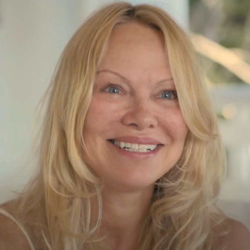 Bare-Faced Pamela Anderson Seemingly Reacts to 'Pam & Tommy' In Netflix Doc Trailer